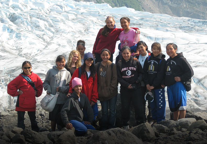 Students hiking on glacier.